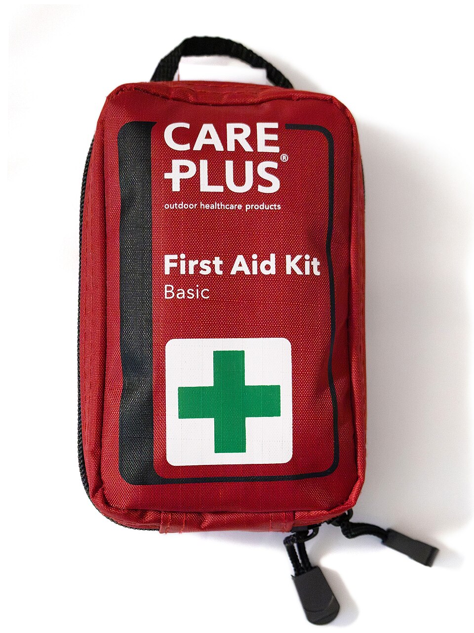 A red zippered pouch labeled First Aid Kit with a green cross, for storm prep in Iowa City, IA